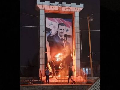 Горящий портрет Башара Асада. Фото: соцсети Горящий портрет Башара Асада. Фото: соцсети